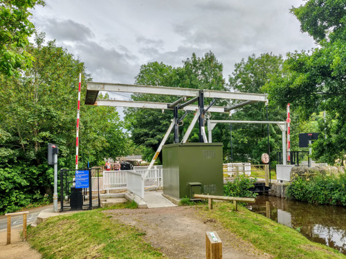 Bridge 144 - Talybont Drawbridge across the canal with the road barriers up